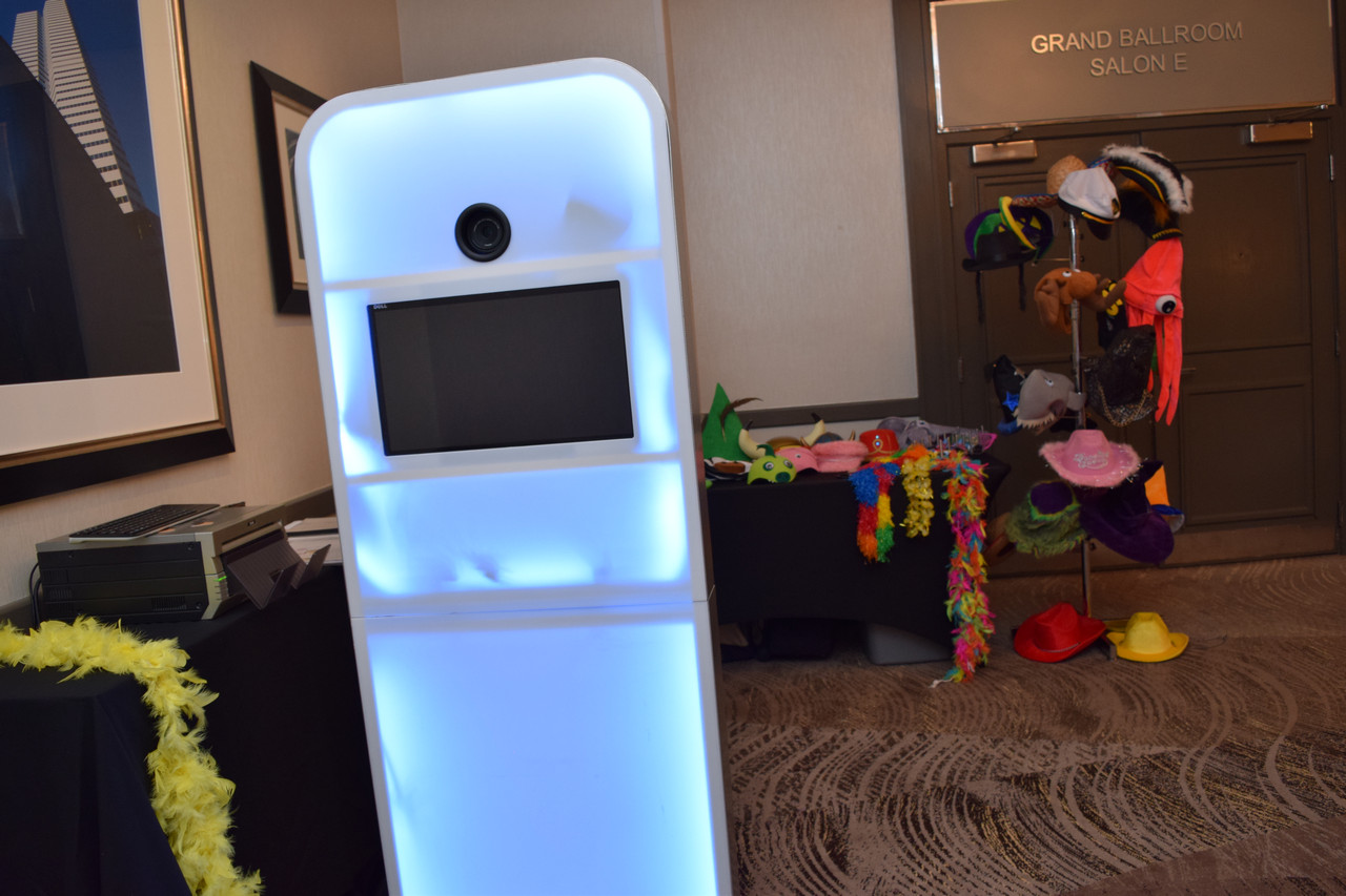 Wedding guests having fun with photo booth props