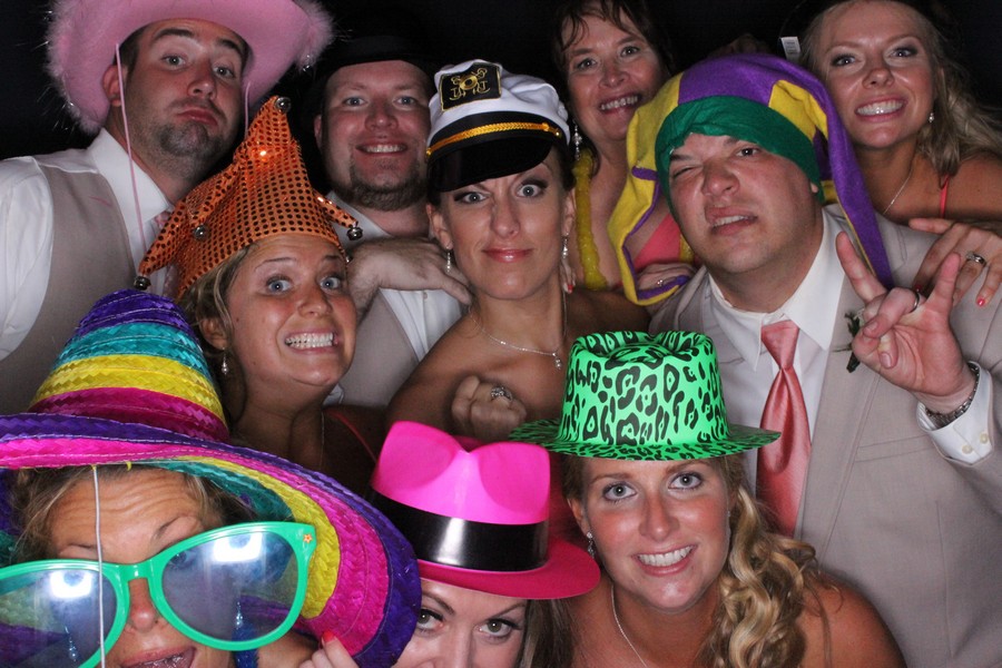 Wedding guests having fun with photo booth props